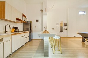 Fridge, microwave, stovetop, coffee/tea maker