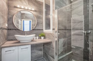 Shower, eco-friendly toiletries, hair dryer, towels