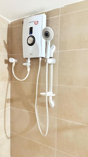 Shower, hair dryer, soap, toilet paper