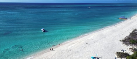 On the beach, sun loungers, beach towels
