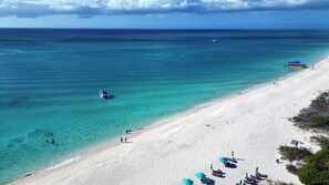 On the beach, sun-loungers, beach towels