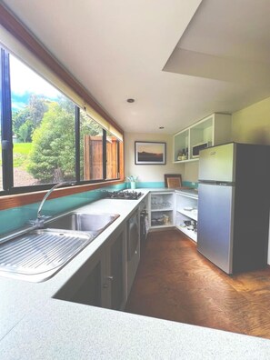Fridge, coffee/tea maker, cookware/dishes/utensils