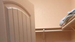 A small, enclosed room with a door, a tiled floor, and a shelf with folded items. - Beautiful private room, garden! (Yuma)