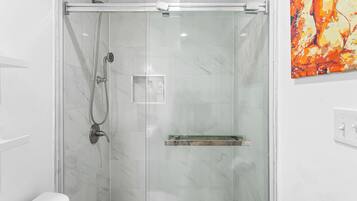 Shower, towels, soap, toilet paper