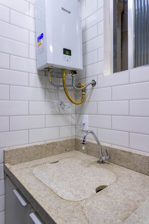 Shower, hair dryer, towels, toilet paper