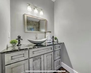 Shower, hair dryer, towels, toilet paper