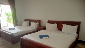 A hotel room with two wooden beds, each with white bedding and pillows. - Siem Reap Local Stay (Siem Reap)