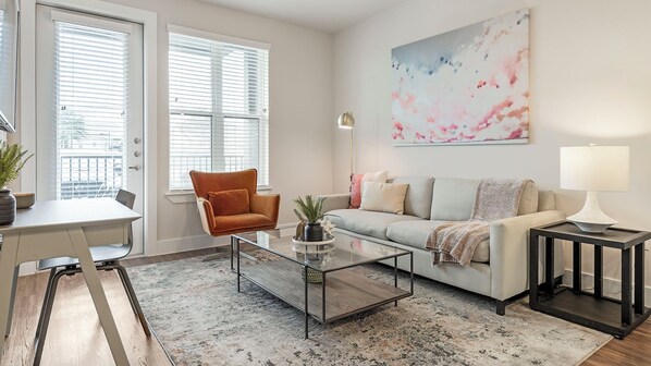 Apartment, 1 Bedroom | Living area | 50-inch TV with digital channels