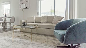 Apartment, 2 Bedrooms | Living area | 50-inch TV with digital channels