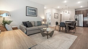Apartment, 2 Bedrooms | Living area | 50-inch TV with digital channels