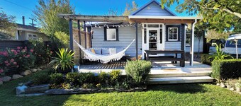 A charming 4-bedroom home! Just steps away from cozy cafes and local shops.