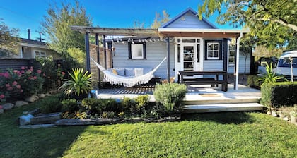 A charming 4-bedroom home! Just steps away from cozy cafes and local shops.