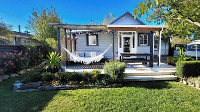 A charming 4-bedroom home! Just steps away from cozy cafes and local shops.