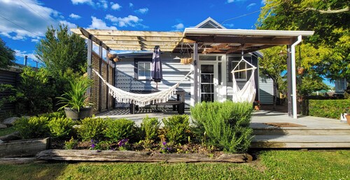 A charming 4-bedroom home! Just steps away from cozy cafes and local shops.