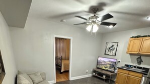 A compact living space with a dining area, kitchenette, and a bedroom. - Fully furnished. we provide all utilities wifi and gated parking. pet friendly (New Orleans)