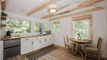 Fridge, microwave, coffee/tea maker, cookware/dishes/utensils