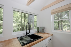 Fridge, microwave, coffee/tea maker, cookware/dishes/utensils