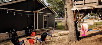 New! Pecan Hide Out is a rustic home with fire pit and tree house!
