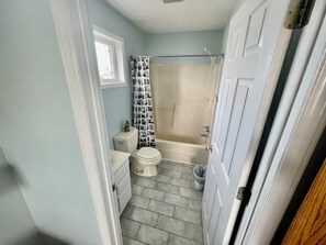Shower, hair dryer, towels, toilet paper