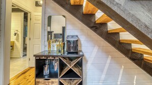 A staircase with wooden steps and a dark wall. - Welcome to Tangled Up Cabin! A Luxury Adults Only HotTub/Sauna Playroom (Blue Ridge)
