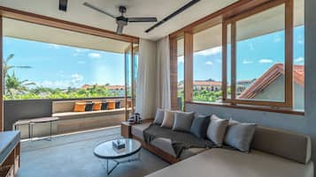 One-Bedroom Apartment - Corner Terrace with Sauna & Ice Bath | Living area | Flat-screen TV