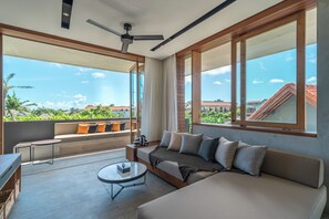 One-Bedroom Apartment - Corner Terrace with Sauna & Ice Bath | Living area | Flat-screen TV