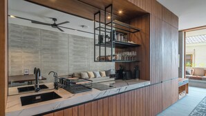 One-Bedroom Apartment with Balcony | Private kitchen | Coffee/tea maker, fridge, microwave, stovetop - Body Factory Lifestyle Residence Canggu (Canggu)