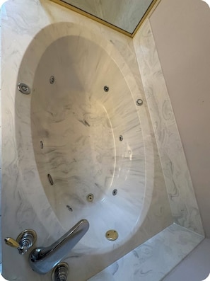 Shower, jetted tub, towels, soap