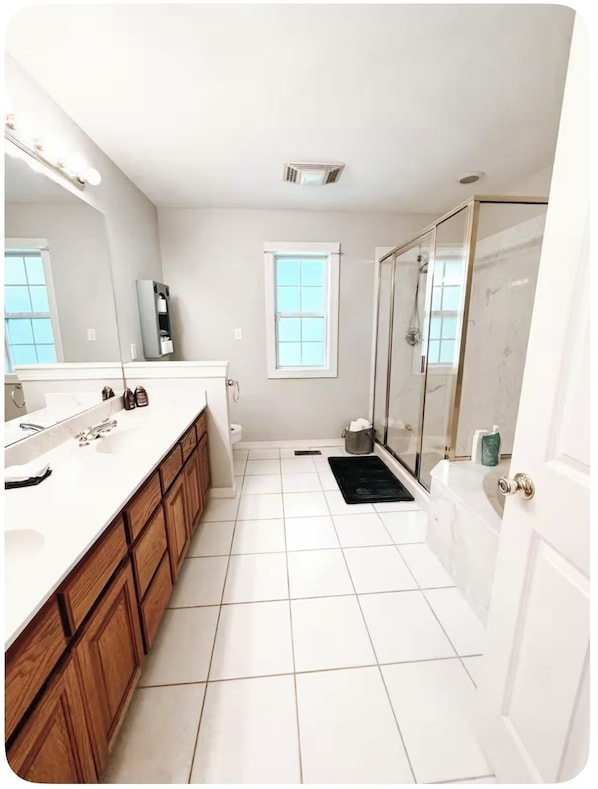 Shower, jetted tub, towels, soap
