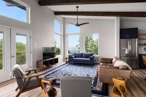 TV, fireplace - Modern Escape w Mountain Views, Fire Pit & Swing (Martinsburg)