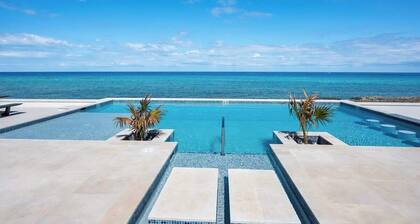Oceans 9 LUXE | 4BR Beachfront Villa in West Bay