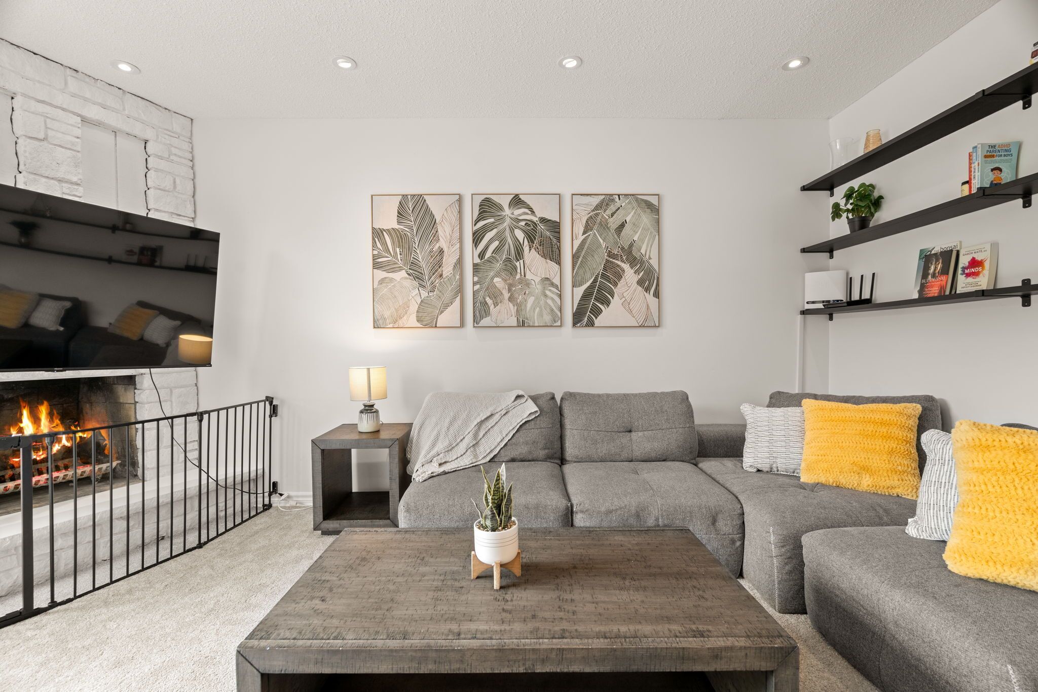 Cozy living room with roomy couch, smart TV, and dimmable lights.