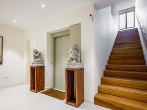 A staircase with wooden steps leading to a landing. - Luxury Villa Martina private heated pool, jacuzzi Abama (Guía de Isora)