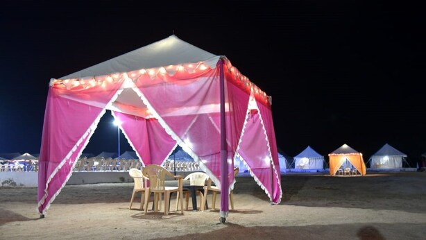A tent with a table and chairs set up for an event. - Prime Desert Camp - Jaisalmer (Jaisalmer)