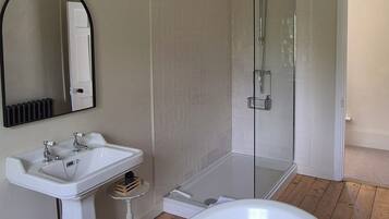 Shower, towels, soap, toilet paper
