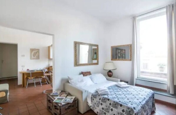 Comfort Apartment, City View | Living area | 43-inch Smart TV with digital channels - Modern Apt near Piazza di Spagna (Rome)