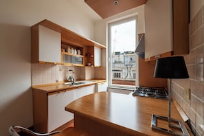 Apartment, 1 King Bed, Balcony | Private kitchen | Dining tables