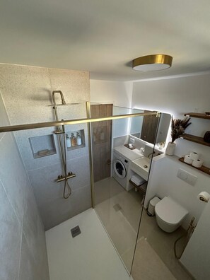 Shower, hair dryer, towels, soap