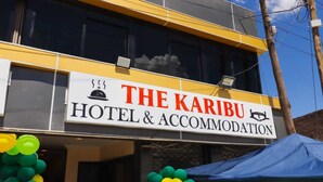 A hotel sign with the name "The Karibu Hotel & Accommodation". - Machakos Gateaway  (Machakos)