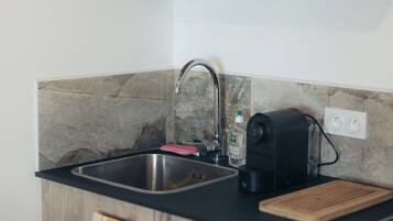 Fridge, microwave, stovetop, coffee/tea maker
