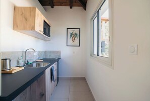 Fridge, microwave, stovetop, coffee/tea maker