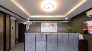 A reception desk with a sign reading "MAHARLIKA CITY INN - BACOLOD". - Maharlika City Inn  (Bacolod)