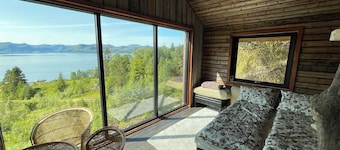 Stunning fiord panorama view off-grid forest cabin