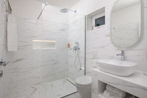 Shower, hair dryer, towels, soap