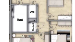 Un plan d’étage comprenant un espace de vie, des toilettes et une chambre à coucher étiquetée « Bad ».