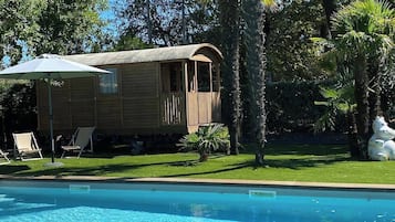 Seasonal outdoor pool, open 8:00 AM to 8:00 PM, pool umbrellas