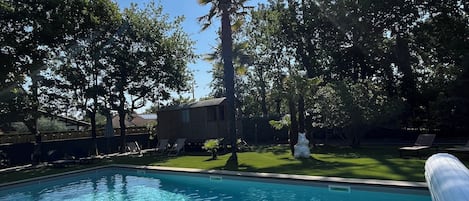 Seasonal outdoor pool, open 8:00 AM to 8:00 PM, pool umbrellas