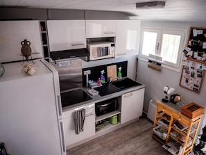 Full-sized fridge, microwave, espresso maker, coffee/tea maker