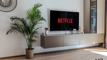 Deluxe Apartment, 1 Bedroom, Mountain View | Living area | 125-cm flat-screen TV with cable channels, Netflix, streaming services