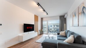 Appartement Deluxe, 1 très grand lit et 1 canapé-lit, balcon | Coin séjour